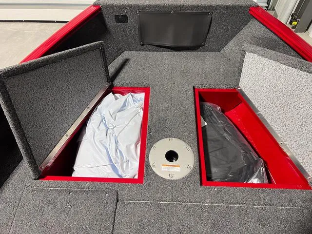 Slide: The Image of 2024 Lund 1650 Rebel XL Sport boat storage compartments. - 27