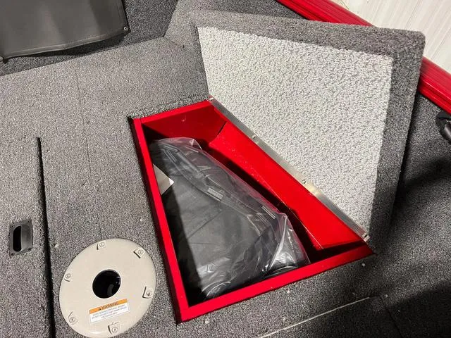 Slide: The Image of Open storage compartment in 2024 Lund 1650 Rebel XL Sport boat. - 28