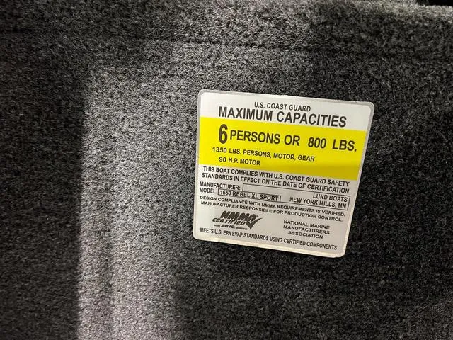 Slide: The Image of 2024 Lund 1650 Rebel XL Sport boat capacity label, 6 persons or 800 lbs, 90 HP motor. - 32