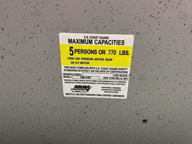 Slide: The Image of 2024 Lund 1600 Fury Tiller boat capacity label, 5 persons or 770 lbs, 40 HP motor. - 21