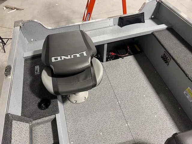 Slide: The Image of 2024 Lund 1600 Fury Tiller boat interior with a swivel seat. - 7