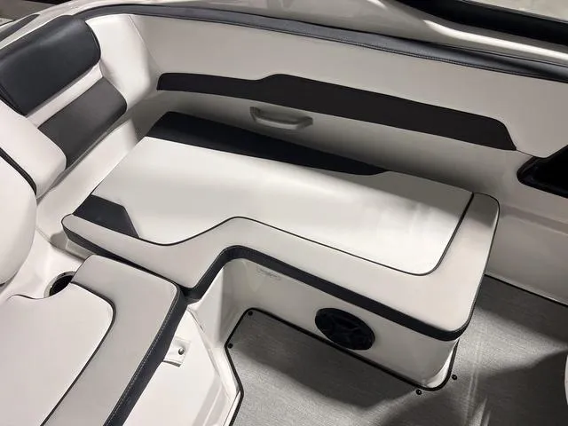 Slide: The Image of 2024 Yamaha Boats SX195 interior seating with black and white upholstery. - 10