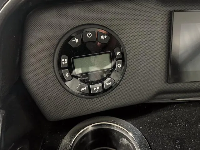 Slide: The Image of Control panel of 2024 Yamaha Boats SX195 with display and buttons. - 20