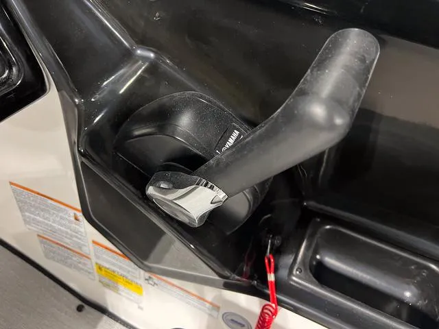 Slide: The Image of Close-up of 2024 Yamaha Boats SX195 throttle control. - 22