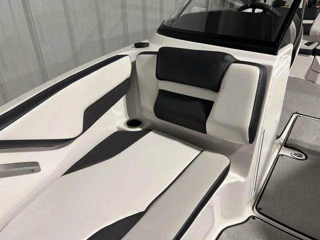 Slide: The Image of 2024 Yamaha Boats SX195 interior seating with white and black upholstery. - 28