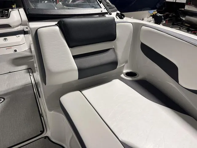 Slide: The Image of 2024 Yamaha Boats SX195 interior seating with black and white upholstery. - 29