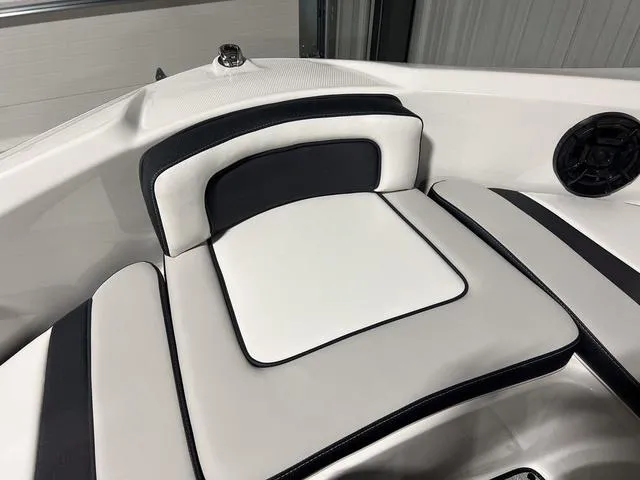 Slide: The Image of 2024 Yamaha Boats SX195 interior seating with black and white upholstery. - 30