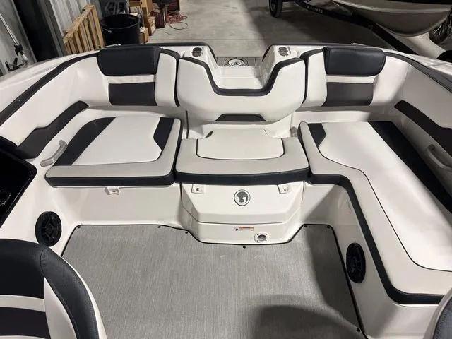 Slide: The Image of 2024 Yamaha Boats SX195 interior seating area with black and white upholstery. - 8