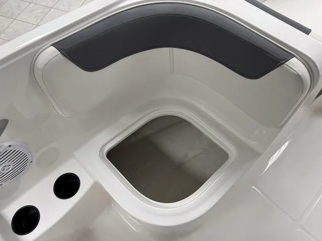 Slide: The Image of 2024 Bayliner E16 LTD boat interior with seating and storage compartment. - 14