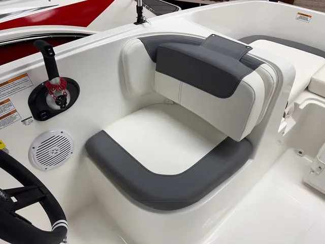 Slide: The Image of 2024 Bayliner E16 LTD boat interior with gray and white seating. - 15