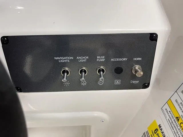 Slide: The Image of Control panel of 2024 Bayliner E16 LTD boat with switches for navigation lights, anchor light, bilge pump, accessory, and horn. - 17