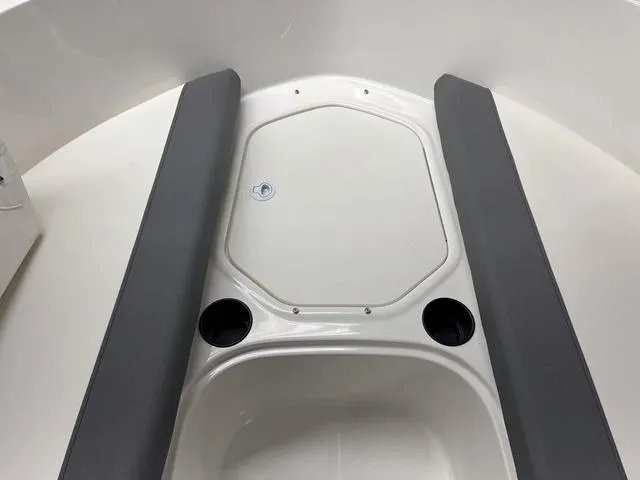 Slide: The Image of 2024 Bayliner E16 LTD boat interior with seating and cup holders. - 21