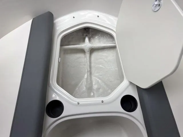 Slide: The Image of 2024 Bayliner E16 LTD boat storage compartment with cup holders. - 22