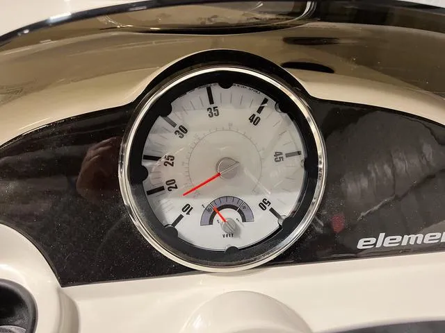 Slide: The Image of Close-up of the 2024 Bayliner E18 LTD speedometer and fuel gauge. - 19
