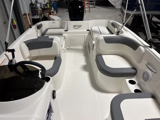 Slide: The Image of 2024 Bayliner E18 LTD boat interior with spacious seating and modern design. - 26