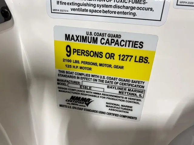 Slide: The Image of 2024 Bayliner E18 LTD capacity label: 9 persons or 1277 lbs, 125 HP motor. - 27
