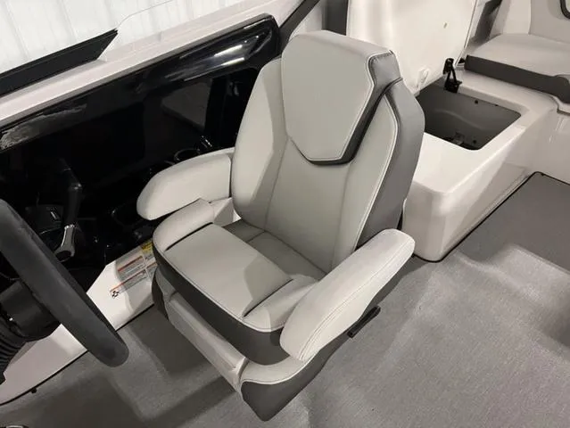 Slide: The Image of 2024 Yamaha Boats AR250 captain's chair with modern design and comfortable seating. - 14