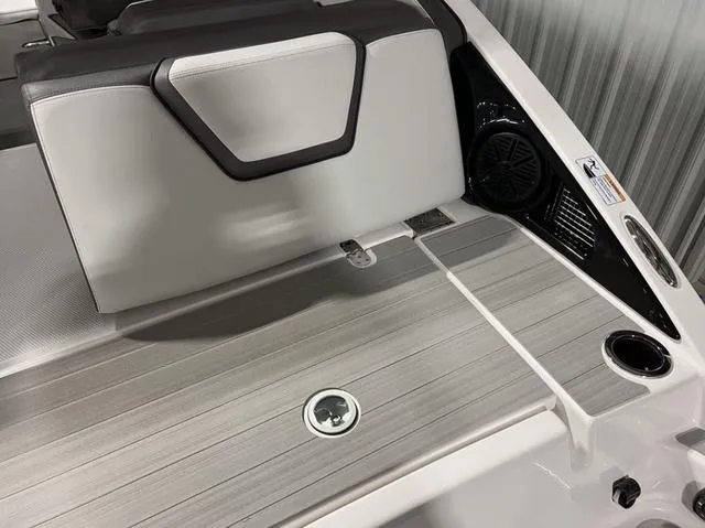 Slide: The Image of 2024 Yamaha Boats AR250 rear deck with seating and speaker. - 20