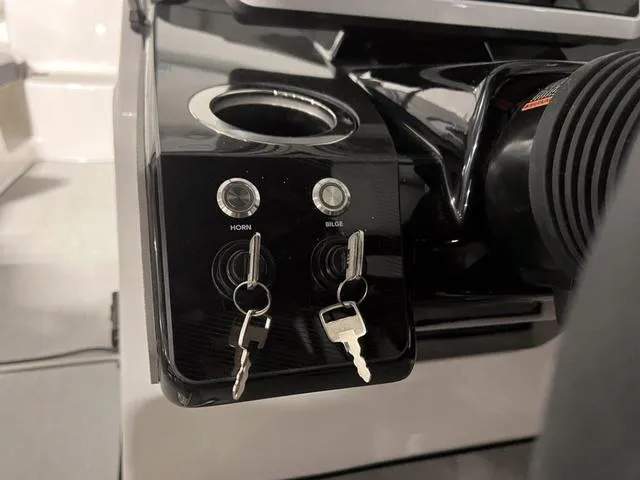 Slide: The Image of Close-up of 2024 Yamaha Boats AR250 control panel with keys inserted. - 21