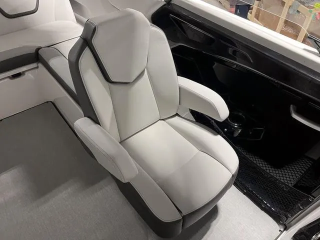 Slide: The Image of 2024 Yamaha Boats AR250 interior seating with modern design and comfortable upholstery. - 25