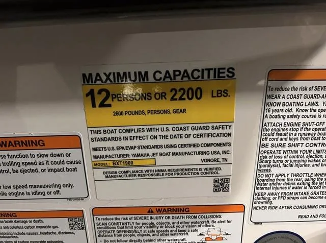 Slide: The Image of 2024 Yamaha Boats AR250 capacity label: 12 persons or 2200 lbs, 2600 lbs total. - 29