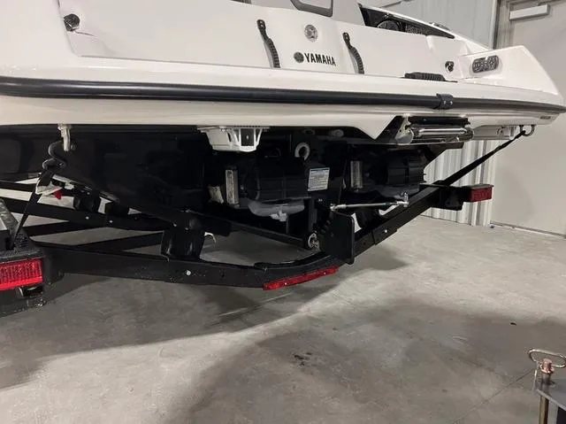 Slide: The Image of 2024 Yamaha Boats AR250 rear view showing dual engines and trailer. - 5