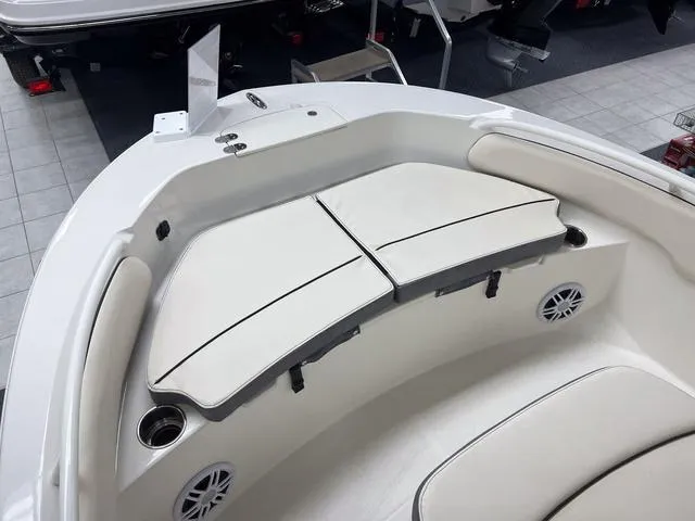 Slide: The Image of 2023 Stingray 173CC boat interior with cushioned seating and cup holders. - 16