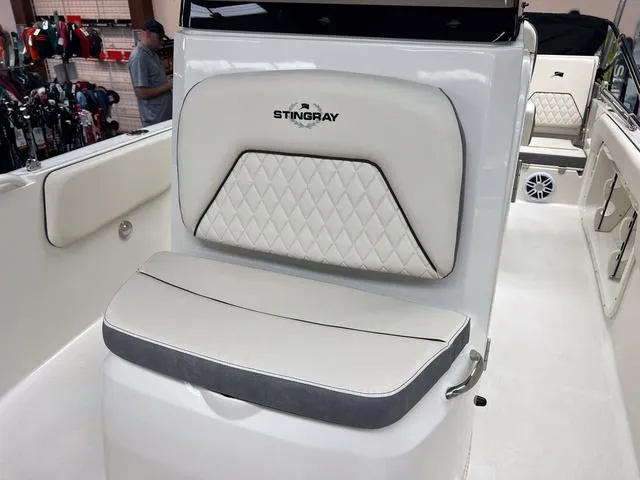 Slide: The Image of 2023 Stingray 173CC boat interior with cushioned seating and diamond-stitched backrest. - 17