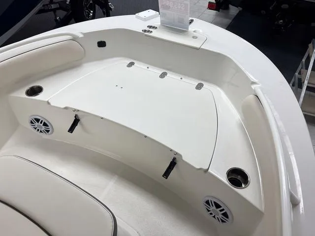 Slide: The Image of 2023 Stingray 173CC boat interior with seating and storage compartments. - 19