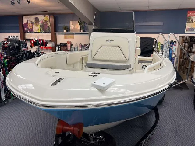Slide: The Image of 2023 Stingray 173CC boat on display in a showroom. - 3
