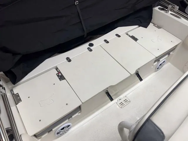 Slide: The Image of 2023 Stingray 173CC boat interior storage compartments and seating area. - 5