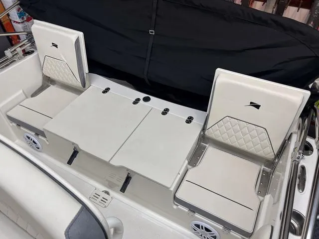 Slide: The Image of 2023 Stingray 173CC boat interior with foldable seats and storage compartments. - 6