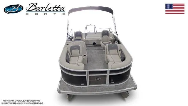 Slide: The Image of 2024 Barletta Boats Aria 20UC pontoon boat, front view, with seating and canopy. - 6