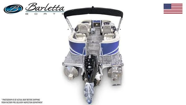 Slide: The Image of 2024 Barletta Boats Aria 20QC pontoon boat, rear view, with motor and seating, American flag. - 3