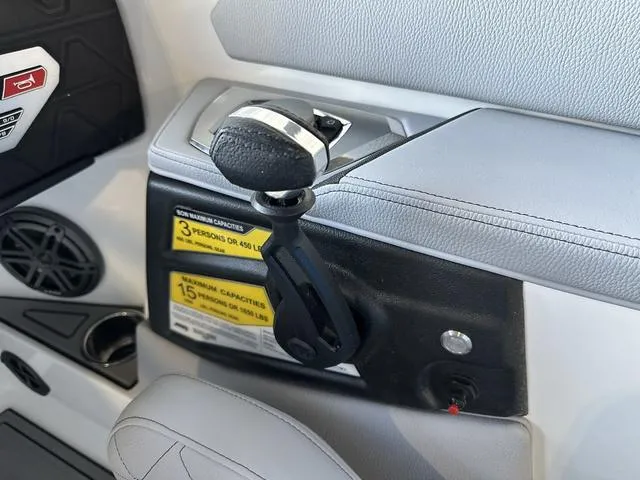 Slide: The Image of 2024 Nautique Super Air Nautique GS22 throttle control and capacity labels. - 15