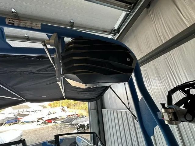 Slide: The Image of 2024 Nautique Super Air Nautique GS22 boat speaker system in a garage. - 25
