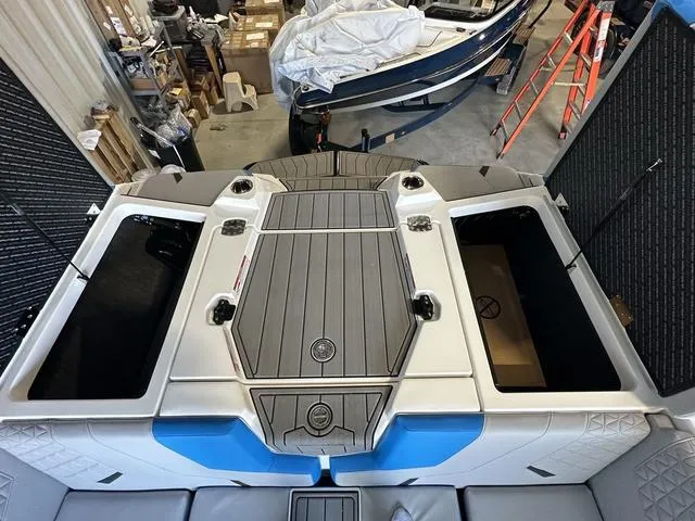 Slide: The Image of 2024 Nautique Super Air Nautique GS22 boat interior, featuring storage compartments and sleek design. - 34