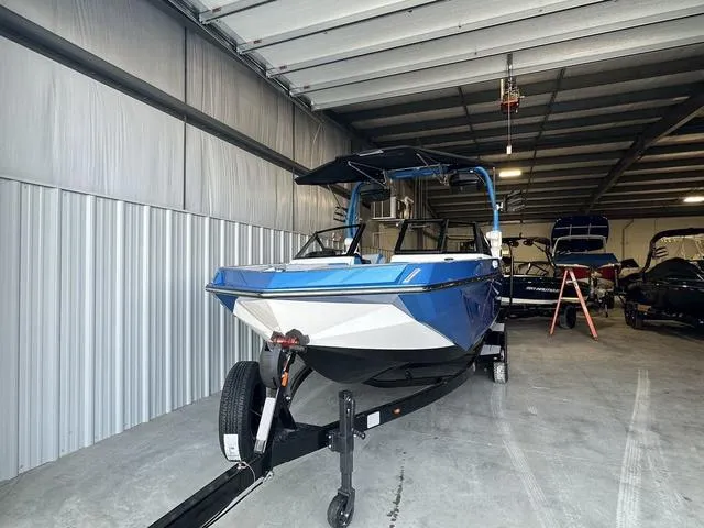 Slide: The Image of 2024 Nautique Super Air Nautique GS22 boat in storage facility. - 38