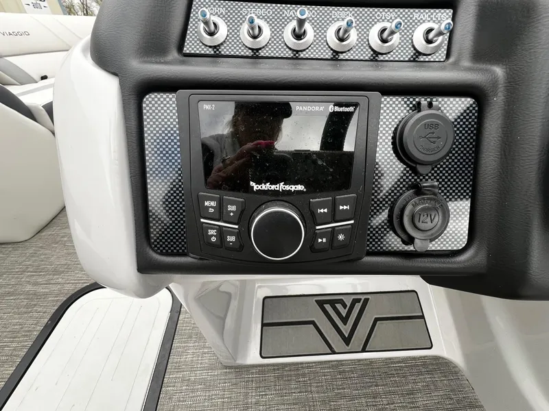 Slide: The Image of Dashboard of 2022 Viaggio 23U Diamante with Rockford Fosgate stereo system. - 11