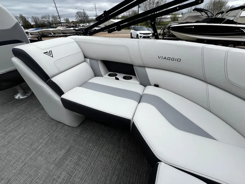 Slide: The Image of 2022 Viaggio 23U Diamante boat interior with luxurious seating and cup holders. - 19