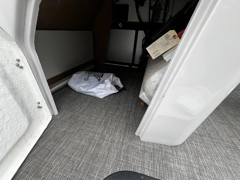 Slide: The Image of Storage compartment of a 2022 Viaggio 23U Diamante boat with carpeted flooring. - 20