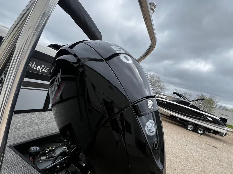 Slide: The Image of Close-up of a 2022 Viaggio 23U Diamante boat with a Mercury outboard motor. - 3