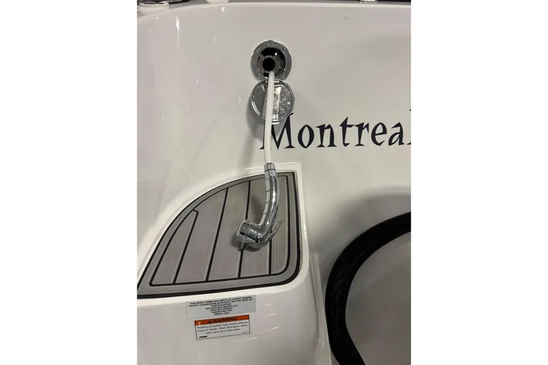 Slide: The Image of 2021 Walker Bay Generation 525 DLX boat detail with fuel inlet and "Montreal" text. - 7