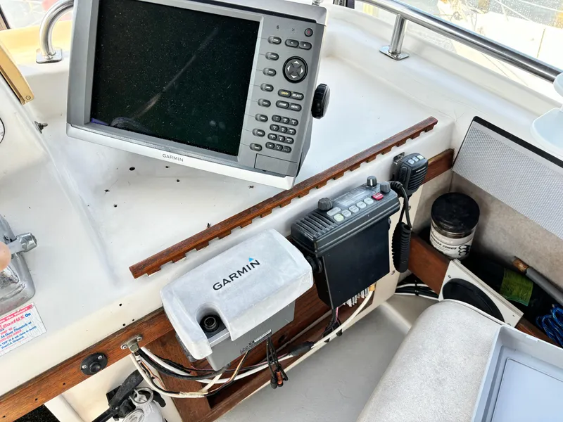 Slide: The Image of Garmin navigation equipment on 1987 Silverton AFT CABIN boat dashboard. - 28