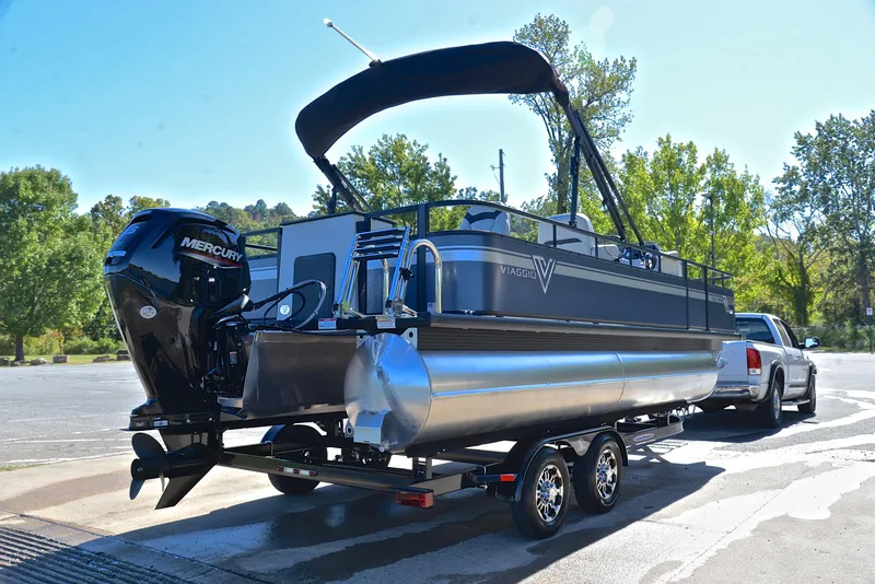 Slide: The Image of 2023 Viaggio DM20F pontoon boat with Mercury outboard engine on trailer. - 12