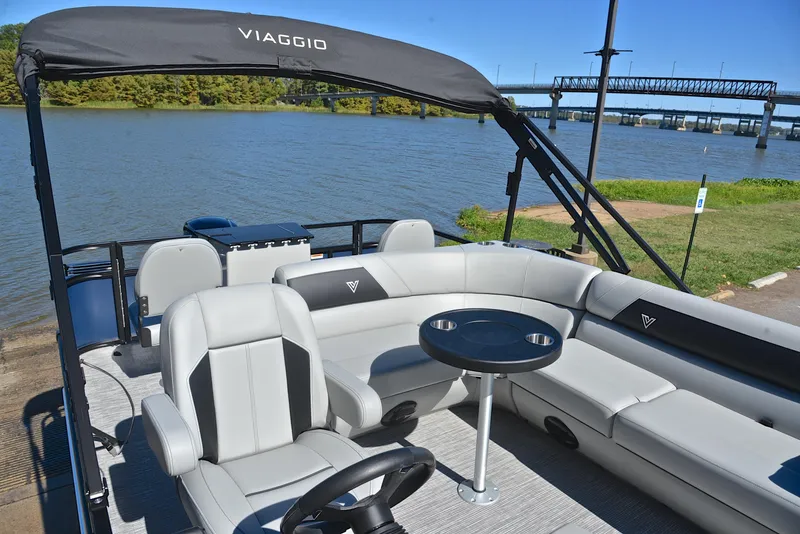 Slide: The Image of 2023 Viaggio DM20F pontoon boat with spacious seating and table on a serene lake. - 20