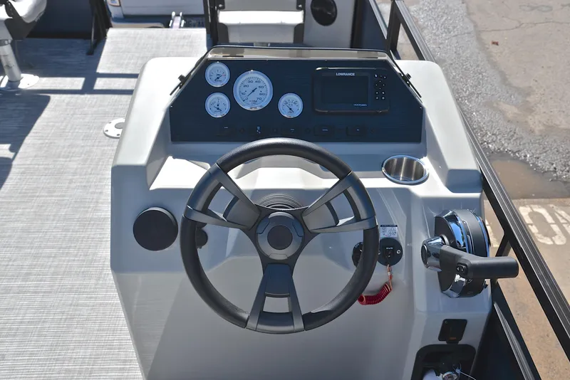 Slide: The Image of 2023 Viaggio DM20F boat dashboard with steering wheel, gauges, and controls. - 22