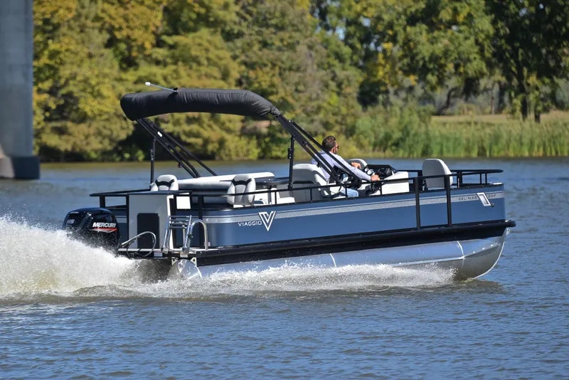 Slide: The Image of 2023 Viaggio DM20F pontoon boat cruising on a lake. - 5