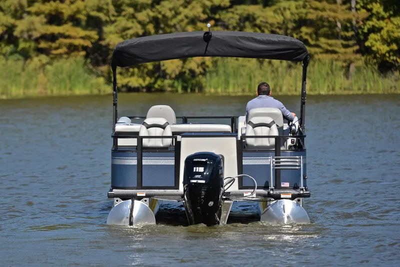 Slide: The Image of 2023 Viaggio DM20F pontoon boat cruising on a lake. - 7