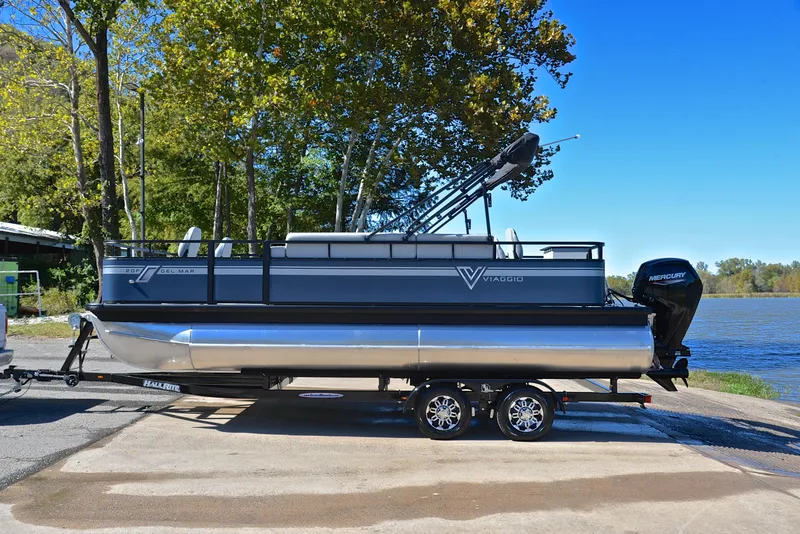 Slide: The Image of 2023 Viaggio DM20F pontoon boat on trailer by a lake. - 9